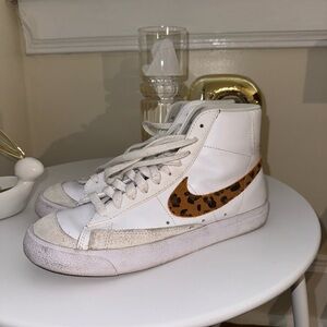 Nike White High-Top Sneakers with Leopard Swoosh